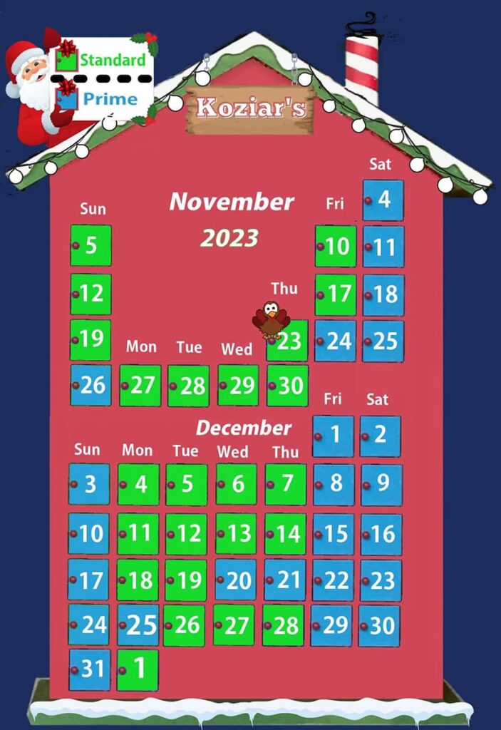 A colorful and festive calendar for November and December 2023, themed around Koziar's Christmas Village in Berks County, Pennsylvania. The calendar features Santa Claus holding a 'Standard' and 'Prime' gift tag, a turkey representing Thanksgiving on the 23rd of November, and decorative elements like snow and Christmas lights on the roof and borders.
