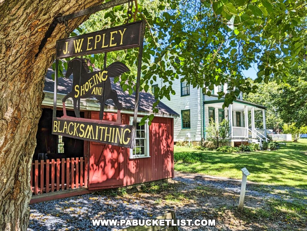 A quaint red blacksmith shop with the sign 'J. W. EPLEY SHOEING AND BLACKSMITHING' under the shade of green leafy trees.