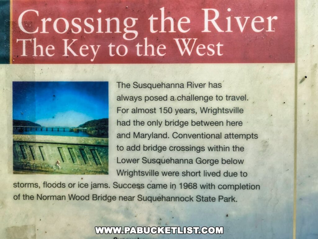 An informational display at Mount Pisgah Overlook in York County, Pennsylvania, titled 'Crossing the River – The Key to the West'. The sign details the historical challenges of crossing the Susquehanna River, with references to Wrightsville’s bridge and the Norman Wood Bridge near Susquehannock State Park. It includes a faded image of a bridge over the river.