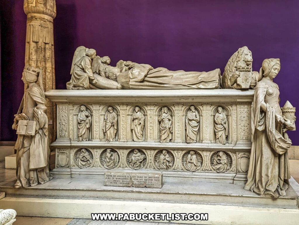 A plaster cast replica of the tomb of Francis II, Duke of Brittany, and his wife Marguerite de Foix, located in the Carnegie Museums of Art and Natural History in Pittsburgh, PA. The detailed sculpture features recumbent figures of the duke and duchess on top, with a procession of mourners and saints carved in high relief on the sides. Statues of noble figures flank the tomb, standing as silent guardians. This piece is part of the museum's collection that replicates significant historical art and architecture.