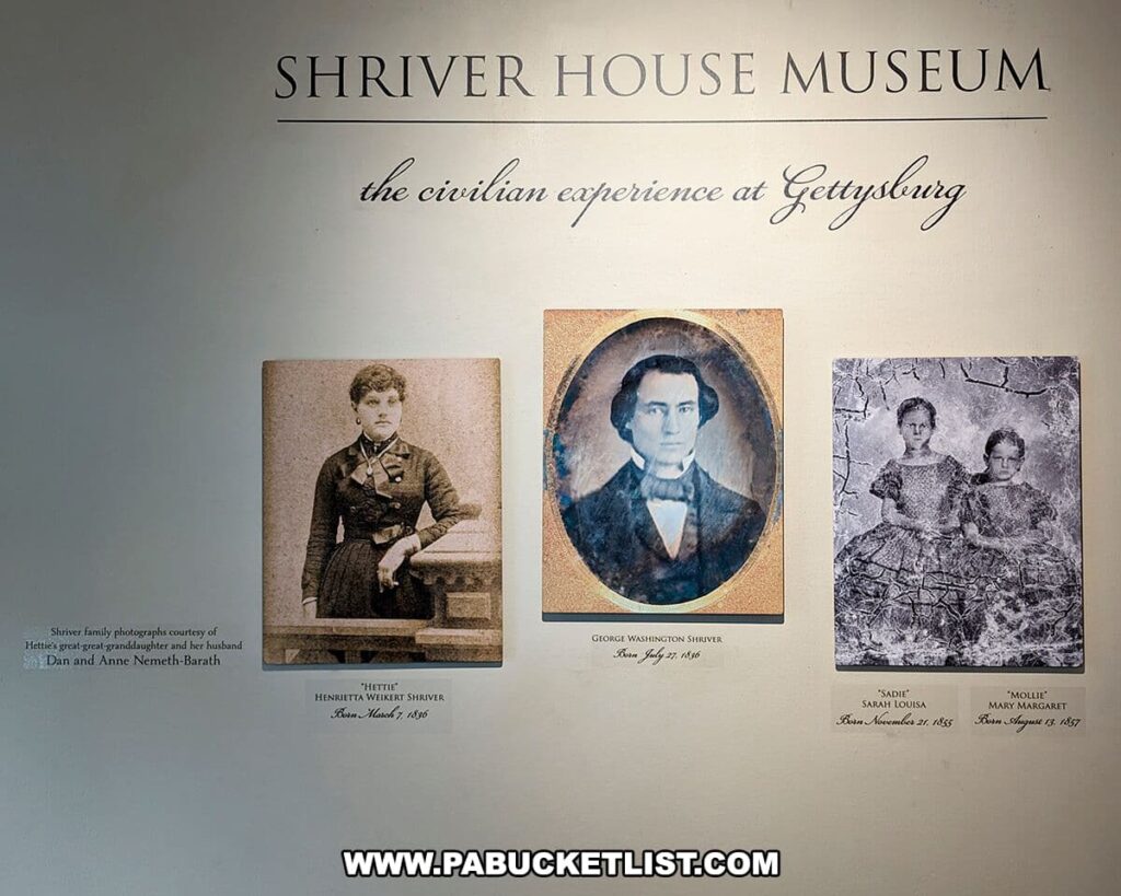 This photo depicts a wall display at the Shriver House Museum in Gettysburg, Pennsylvania, presenting the civilian experience during the Civil War. It features three framed portraits: on the left is "Hettie" Henrietta Shriver, born March 18, 1848; in the center is George Washington Shriver, born May 27, 1826; and on the right are "Sadie" Sarah Louisa and "Mollie" Mary Margaret, born November 28, 1855, and August 4, 1857, respectively. The portraits are accompanied by labels with their names and dates, providing a personal connection to the family who lived in the house during that tumultuous period.