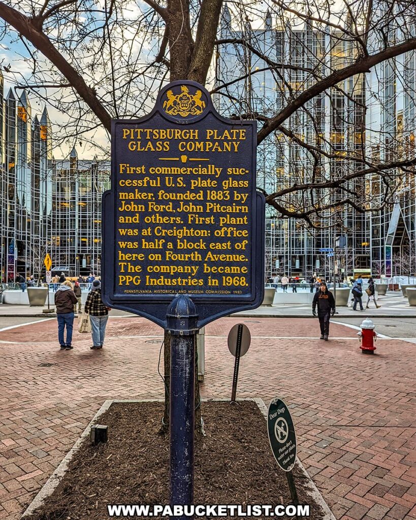 A historical marker in Pittsburgh, Pennsylvania, detailing the history of the Pittsburgh Plate Glass Company. The plaque is set against an urban backdrop with modern buildings and pedestrians. It states that the company was the first commercially successful U.S. plate glass maker, founded in 1883, and became PPG Industries in 1968. The company's first plant was at Creighton, and its office was located a half block east of the marker on Fourth Avenue.