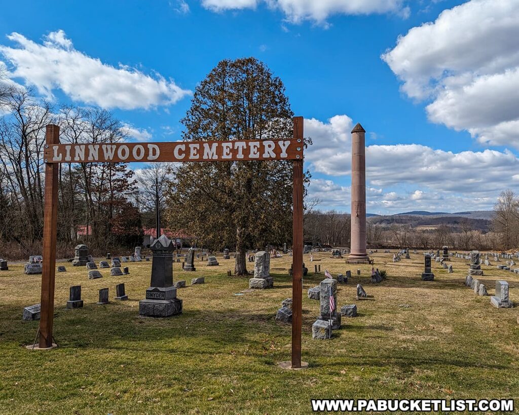 A view of the PA Capitol Column War memorial at Linnwood Cemetery near Lock Haven in Clinton County Pennsylvania. View os from Linnwood Drive looking west towards the monument.