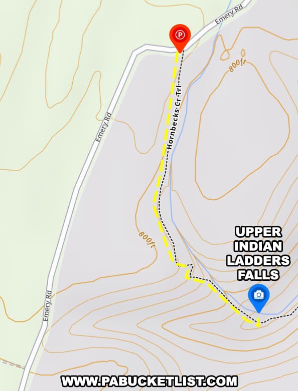 A map illustrating the route to Upper Indian Ladders Falls in Pike County, Pennsylvania. The map shows the parking area marked with a red "P" along Emery Road and the trailhead for Hornbecks Creek Trail. The trail, depicted with a dashed yellow line, leads southward to the location of Upper Indian Ladders Falls, marked with a blue icon. Contour lines indicate the elevation changes along the trail. The map provides a clear and helpful visual guide for hikers navigating the path to the waterfall.