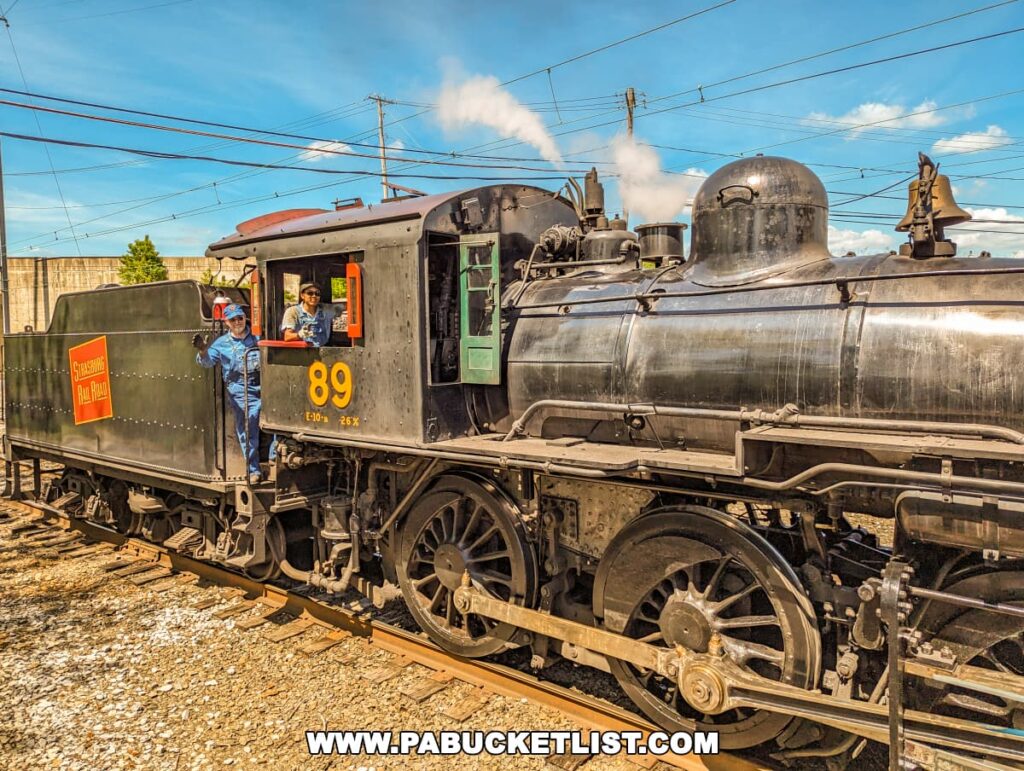 Black steam train on a train track at Strasburg Railroad in Lancaster, Pennsylvania.