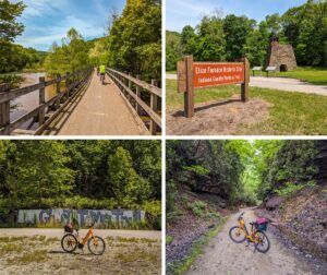 Four images from a bike ride along the Ghost Town Trail in western Pennsylvania. The first image shows a cyclist riding over a wooden bridge surrounded by lush green trees. The second image features a sign for the Eliza Furnace Historic Site, with a stone furnace and informational displays in the background. The third image captures an orange bicycle parked in front of a graffiti-covered wall that reads "Ghost Town Trail" amidst dense forest. The fourth image depicts a narrow, tree-lined trail with steep rock walls, where the same orange bicycle is parked on the path.