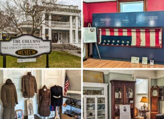 A collage of four photos taken at the Columns Museum in Pike County, PA. The top left photo shows the museum's exterior, a stately white building with large columns, and a sign indicating it is the home of the Pike County Historical Society and the Lincoln Flag. The top right photo features the display of the famous "bloody Lincoln flag," believed to have cushioned President Lincoln's head after he was shot. The bottom left photo shows a collection of military uniforms and artifacts, representing the contributions of local veterans. The bottom right photo displays a room filled with historical artifacts, including a cabinet with dishes, a grandfather clock, and a portrait of Charles Sanders Peirce along with his personal effects. This collage highlights the museum's diverse exhibits and rich historical collections.