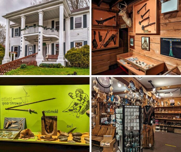 A collage of four photos taken at the Pocono Indian Museum in Monroe County, PA. The top left image shows the front entrance of the museum, a white colonial-style building with columns and a ramp leading up to the porch. The top right image displays an interior exhibit featuring Native American artifacts, including a mounted deer head, traditional weapons, and tools. The bottom left image showcases a green exhibit with stone tools and weapons such as an atlatl, spear thrower, post mold, and awl, along with illustrative drawings. The bottom right image captures the gift shop, highlighting a variety of Native American-themed jewelry, dreamcatchers, and clothing, arranged on shelves and racks in a rustic setting.