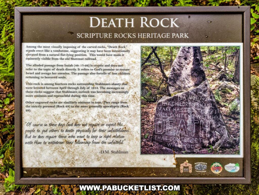 An interpretive panel at Scripture Rocks Heritage Park in Jefferson County, Pennsylvania, detailing the history of Death Rock. The panel explains the significance of the rock, which stands erect like a tombstone and features a cryptic and ominous inscription from Isaiah (49:17-26). It describes how Douglas M. Stahlman's later carvings, including Death Rock, reflect his increasingly pessimistic outlook. The panel includes an image of Death Rock, along with quotes from Stahlman, providing context about the darker tone of his later work.