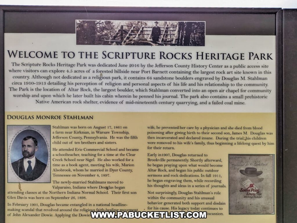 An informational sign at Scripture Rocks Heritage Park in Jefferson County, Pennsylvania, welcoming visitors and providing historical context about the park and its creator, Douglas Monroe Stahlman. The sign explains the park's dedication in June 2016 and details the 4.5-acre site featuring 64 sandstone boulders engraved by Stahlman between 1910 and 1913. It highlights significant features like Altar Rock, a prehistoric Native American rock shelter, and the remnants of a failed coal mine. The sign also includes a biography of Douglas M. Stahlman, recounting his life events, including his wife's death, his subsequent religious fervor, and the lasting impact of his carvings.