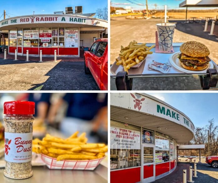 A collage of four images showcasing the Red Rabbit Drive-In Restaurant in Duncannon, PA, capturing its nostalgic 1950s-style charm and signature menu items. The top-left image features the restaurant’s curved overhang with the slogan “Make the Red Rabbit a Habit,” large front windows with menu signage, and a red pickup truck parked in front. The top-right image highlights a classic carhop tray meal, including a Bunny Burger with melted cheese and crispy bacon, golden French fries, a soft drink in a retro-style cup, and a ketchup packet, all served on a tray attached to a car window. The bottom-left image provides a close-up of a bottle of Bunny Dust seasoning alongside a tray of crispy fries, showcasing the restaurant’s signature seasoning blend. The bottom-right image focuses on the front window signage, emphasizing the drive-in’s long history as a three-generation family business since 1964, and its unique carhop ordering system where customers turn on their hazard lights for service.