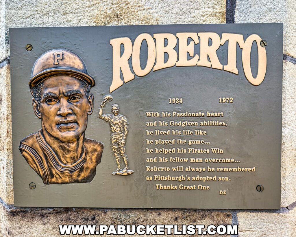 Commemorative plaque on the Roberto Clemente Bridge in Pittsburgh, PA, featuring a sculpted portrait and image of Clemente in uniform, along with an inscription honoring his passion, talent, and legacy as both a Pittsburgh Pirates legend and a beloved humanitarian.