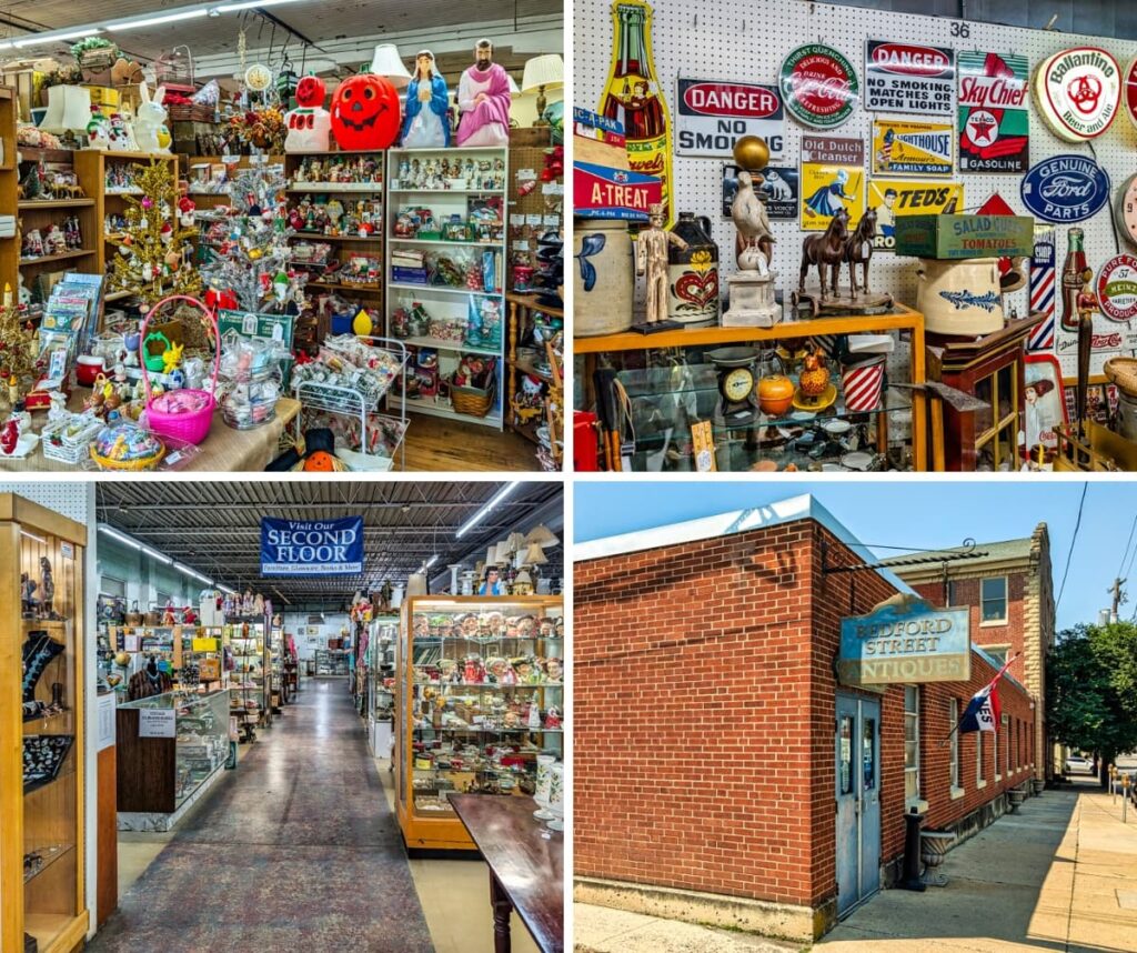 Collage of four images taken at Bedford Street Antiques in Carlisle, Pennsylvania, featuring a festive booth filled with vintage holiday decorations, a vendor space showcasing colorful advertising signs and stoneware, a wide interior aisle lined with display cases and antiques beneath industrial lighting, and the exterior of the red brick building with a retro hanging sign and American flags along the sidewalk.
