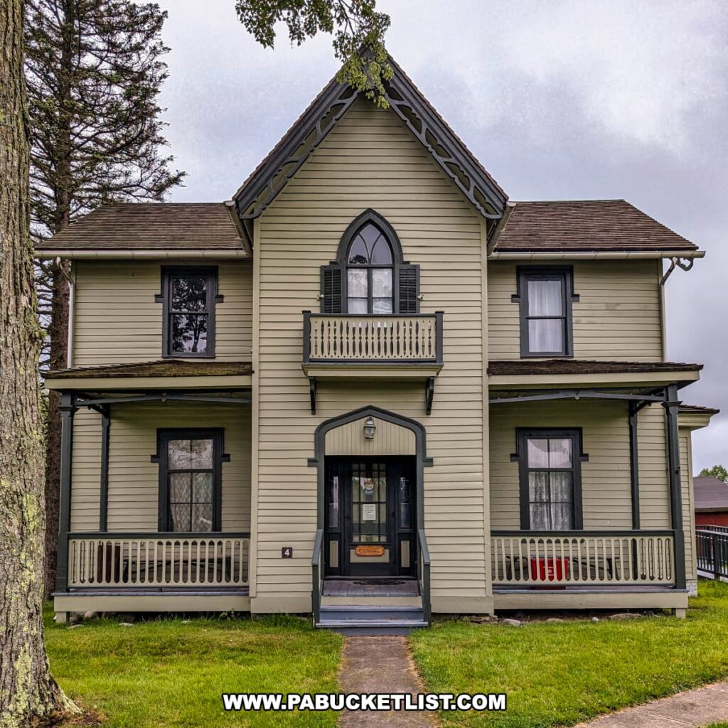 Large Victorian-style single-family home at Eckley Miners’ Village in Luzerne County, Pennsylvania, featuring decorative trim, arched windows, and double porches, representing the more spacious residences occupied by mine officials in the 19th-century coal patch town.