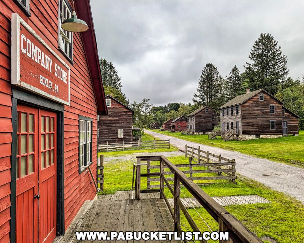 View of Main Street at Eckley Miners’ Village in Luzerne County, PA, featuring the red-painted company store and rows of preserved miners’ houses.