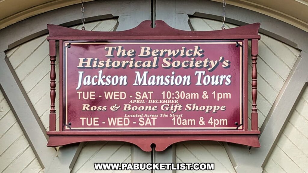Sign for the Berwick Historical Society’s Jackson Mansion Tours displaying tour days and times, along with information about the Ross & Boone Gift Shoppe.