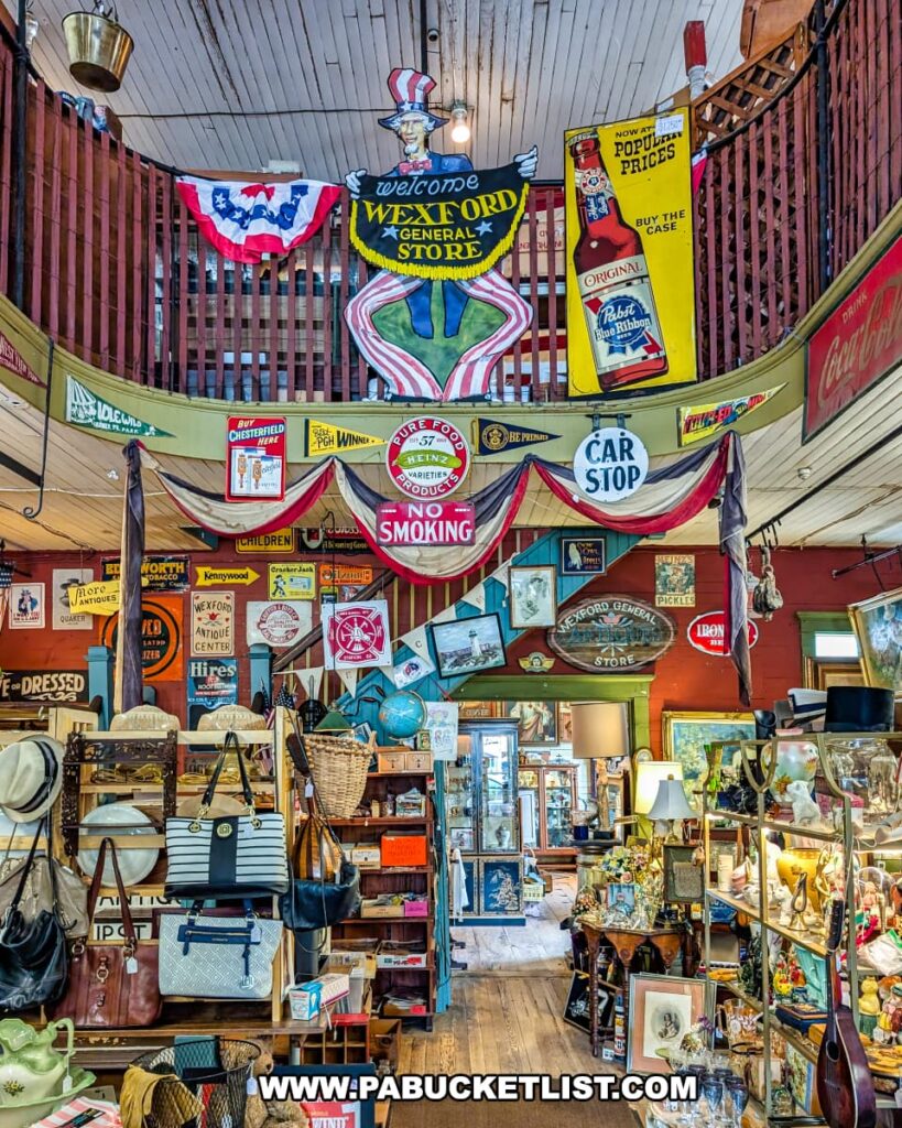 Colorful interior view of Wexford General Store Antiques in Allegheny County, PA showcasing shelves of vintage goods, handbags, and collectibles beneath a balcony decorated with antique advertising signs and a welcoming Uncle Sam figure.