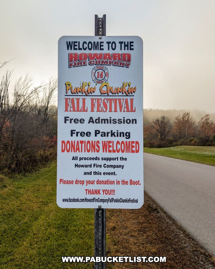 Entrance sign for the Punkin Chunkin Fall Festival at Bald Eagle State Park in Centre County, PA, hosted by the Howard Fire Company, advertising free admission, free parking, and encouraging donations to support the fire company and the event.