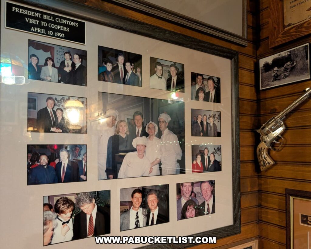 A framed collage of photographs inside Cooper’s Seafood House in Scranton, Pennsylvania, commemorating President Bill Clinton’s visit to the restaurant on April 10, 1993, featuring images of him posing with staff and guests.