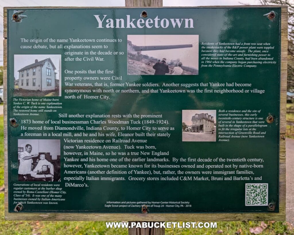 Informational sign along the Hoodlebug Trail in Indiana County, Pennsylvania, detailing the history and possible origins of the name “Yankeetown.” The green sign includes vintage photos of local buildings, residents, and businesses, along with text explaining how the area north of Homer City may have been named for Civil War veterans, northern settlers, or local businessman Charles Woodman Tuck. It also notes that Yankeetown later became known for its Italian-American community and family-owned shops. The sign stands near the 10-mile Hoodlebug Trail, which follows the former Pennsylvania Railroad’s Indiana Branch once traveled by the self-propelled “Hoodlebug” passenger coach.