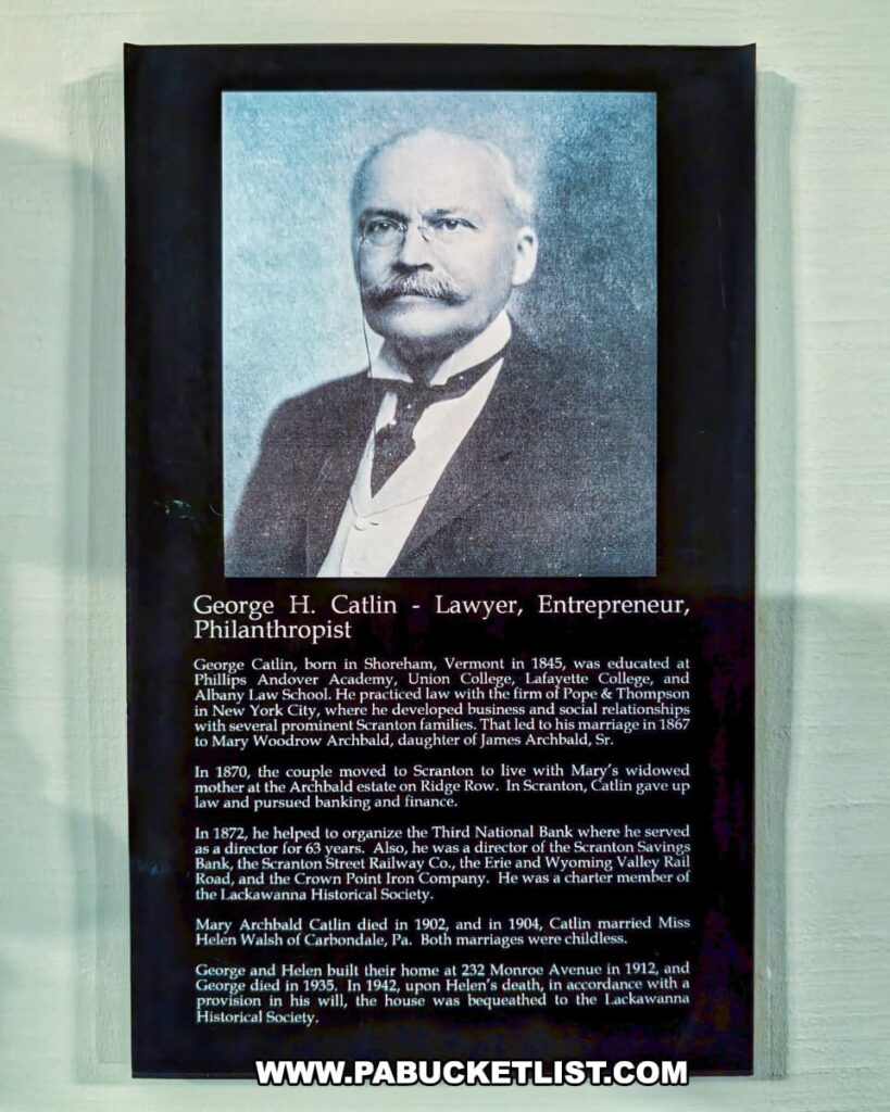 Plaque honoring George H. Catlin at the Lackawanna Historical Society Museum in Scranton, Pennsylvania, featuring his portrait and biography. The text details Catlin’s life as a lawyer, entrepreneur, and philanthropist who helped organize the Third National Bank, served as a director of several Scranton companies, and was a charter member of the society. It notes that he and his wife Helen built the Catlin House in 1912, later bequeathed to the Lackawanna Historical Society as its headquarters.
