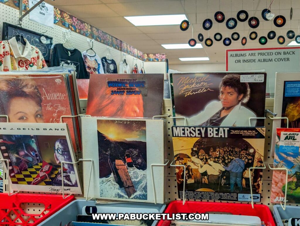 Display of vintage vinyl records at Black Rose Antiques in Hanover, Pennsylvania, featuring classic album covers including Michael Jackson’s “Thriller,” The J. Geils Band, and other retro music selections, with hanging miniature records decorating the space.