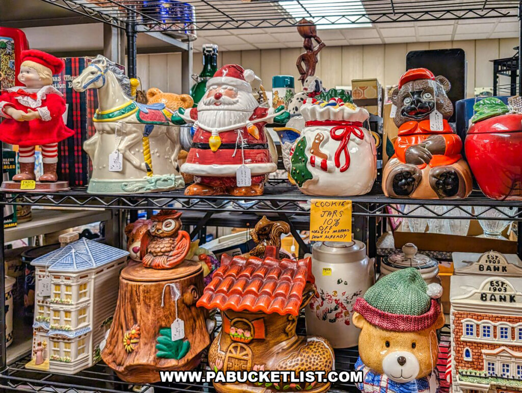 A display of vintage ceramic cookie jars at Black Shutter Antiques in New Oxford, Pennsylvania, featuring colorful holiday figures, animals, and novelty designs arranged on metal shelving inside the multi-vendor antique store