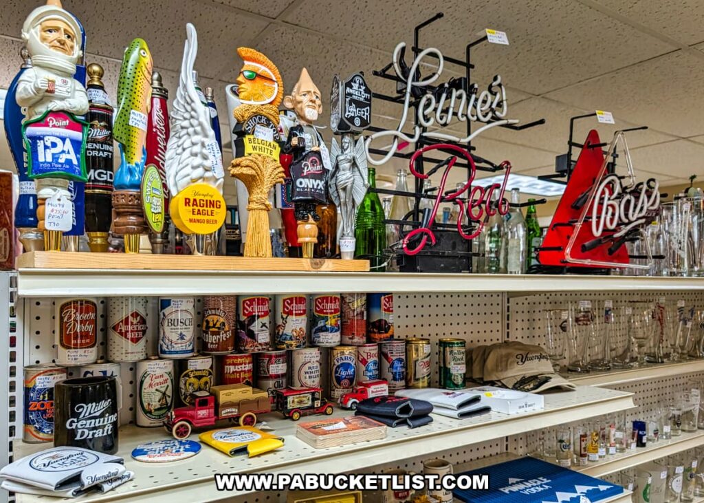Display shelves inside Dover Antique Mall in York County, Pennsylvania, filled with vintage beer cans, tap handles, barware, neon-style signs, and brewery collectibles, showcasing a large assortment of retro beer memorabilia from multiple vendors.