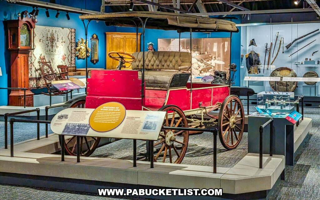 Vintage early automobile on display at the York County History Center, surrounded by historic furnishings, tools, and transportation artifacts that illustrate the evolution of travel and daily life in York County.