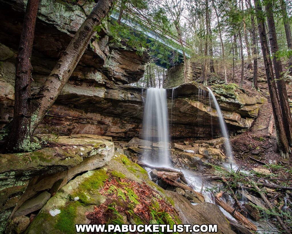 Side view of Kildoo Falls dropping from a rocky ledge beneath the road bridge at McConnells Mill State Park in Lawrence County, Pennsylvania.