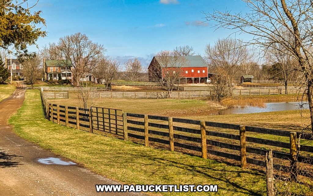 Historic farmhouse, barn, and fenced pasture on the Gettysburg Battlefield viewed from a Gettysburg Railway sightseeing train excursion in Gettysburg, Pennsylvania.