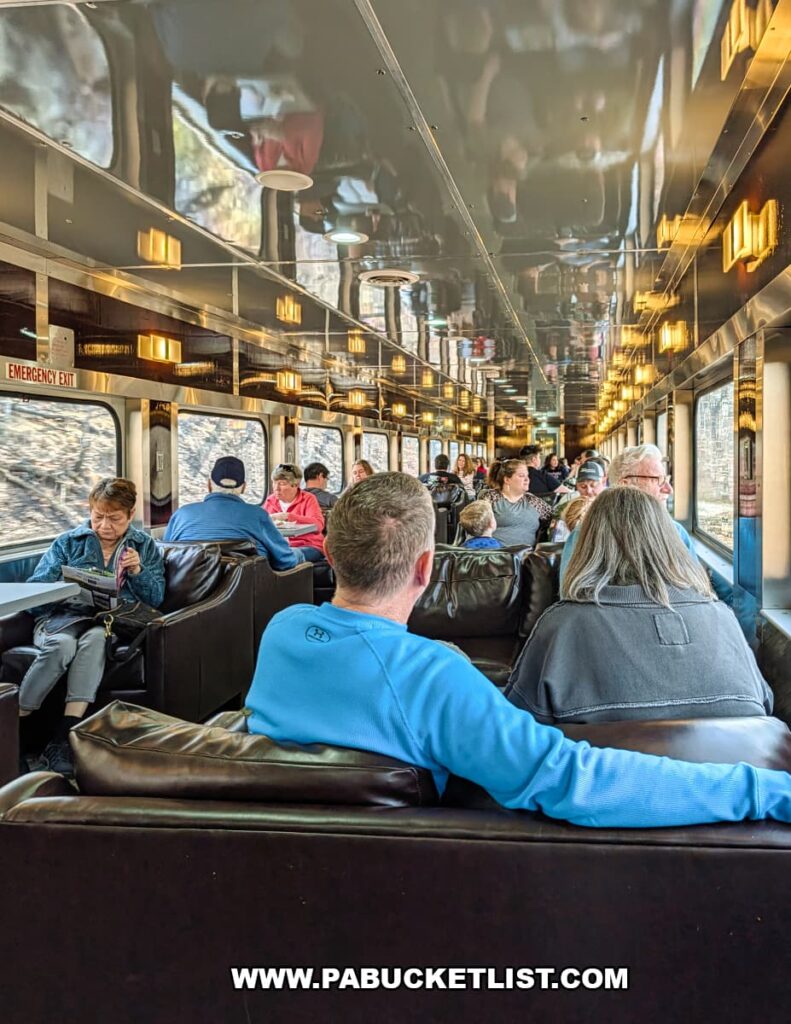 Passengers seated inside a Gettysburg Railway sightseeing excursion train car traveling past the Gettysburg Battlefield in Gettysburg, Pennsylvania.