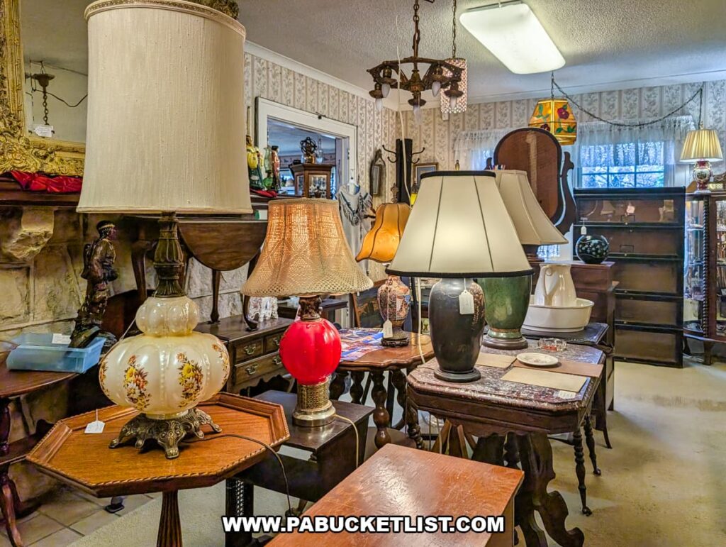Display of vintage table lamps and antique furniture inside Wagon Wheel Antiques in Butler County, Pennsylvania.