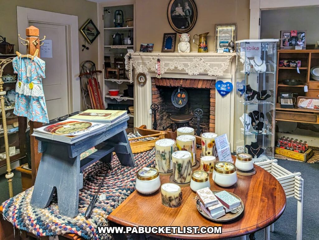 Interior room with antique fireplace candles vintage decor and display cases inside Sugar Grove Antiques in Somerset County PA