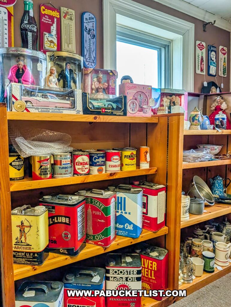 Shelves displaying vintage motor oil cans toys and advertising collectibles inside Sugar Grove Antiques in Somerset County PA