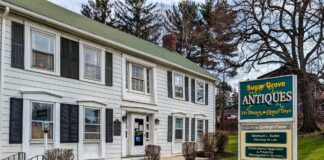 Front exterior of Sugar Grove Antiques in Somerset County PA a multi-vendor antique shop housed in one of the oldest log frame homes in Somerset