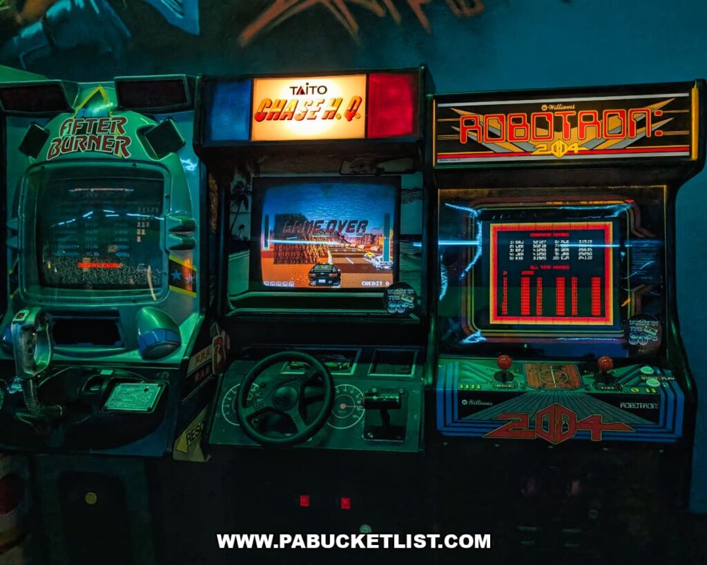 After Burner, Chase H.Q., and Robotron 2084 arcade machines at Timeline Arcade in York County Pennsylvania showcasing classic 1980s arcade games