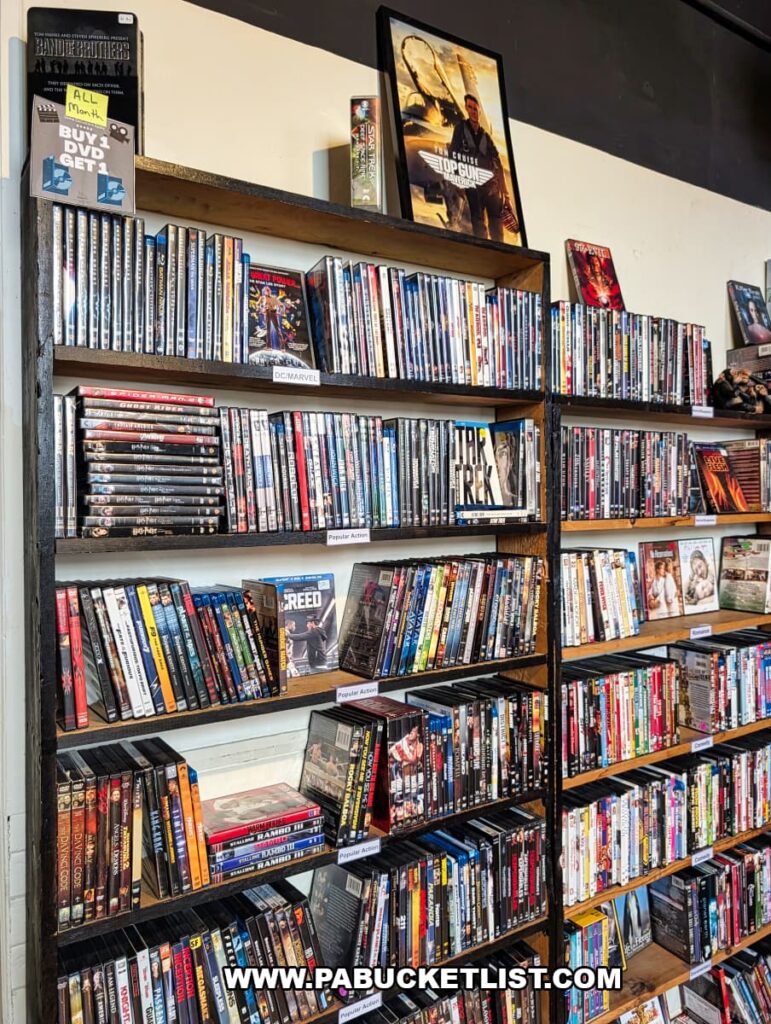 Shelves filled with DVDs and movies for sale at In Between Pages Bookstore in York PA featuring rows of films spanning many genres