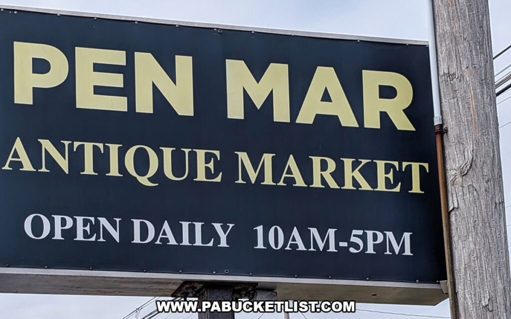 Sign for Pen-Mar Antique Market in Waynesboro Pennsylvania advertising daily hours for the antique mall with more than 200 vendors selling antiques collectibles and vintage goods