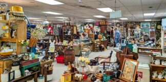 Wide interior view of vendor booths filled with antiques, furniture, and collectibles at Treasure Bin Antiques in Red Lion, York County, Pennsylvania