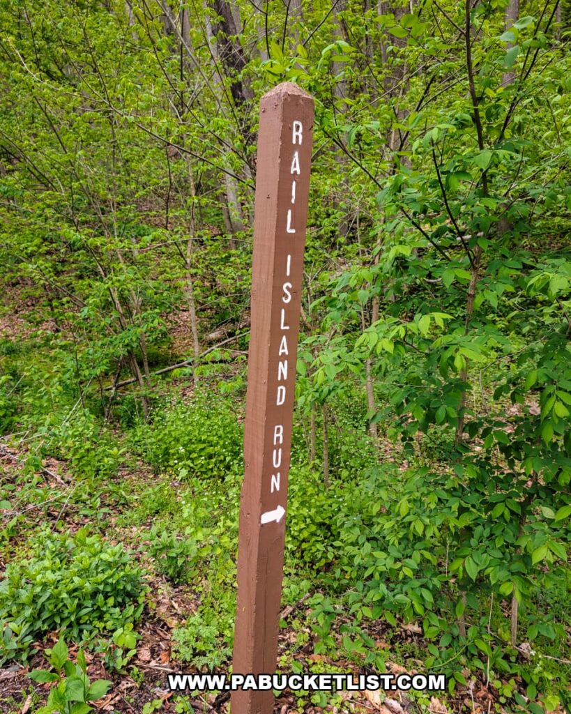 Rail Island Run trail marker along the Pine Creek Rail Trail in Tioga County, Pennsylvania.